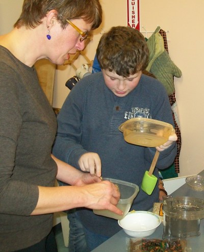 volunteers Lisa helping Seth cook